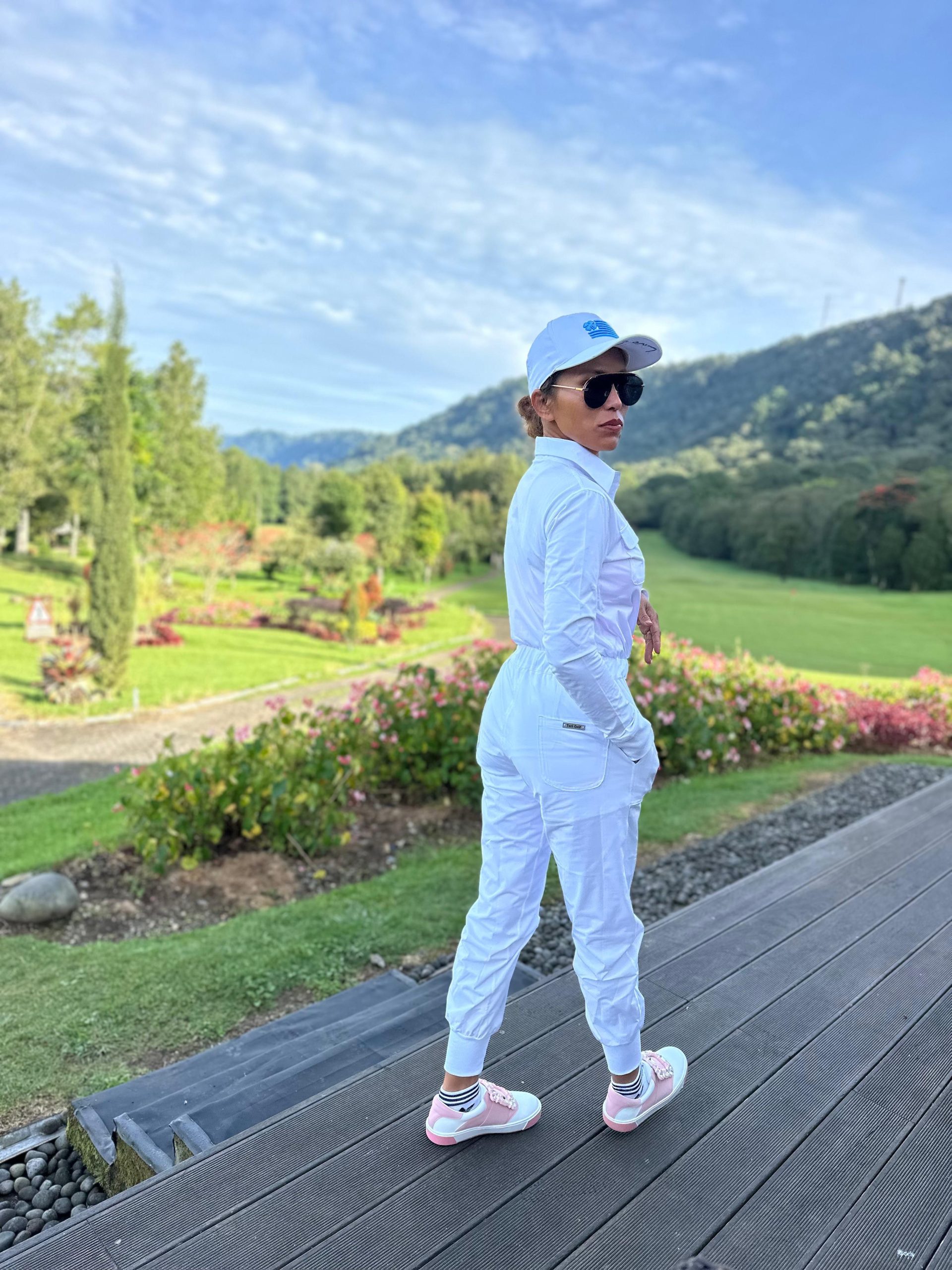 LJS-001A || Ladies Golf Jumpsuit Long Sleeve with Collar Neck White Color and Long Pants, with a Zipper in Front and 2 Pockets on The Right and Left of The Chest and Elastic Band on The Waist. - Image 6